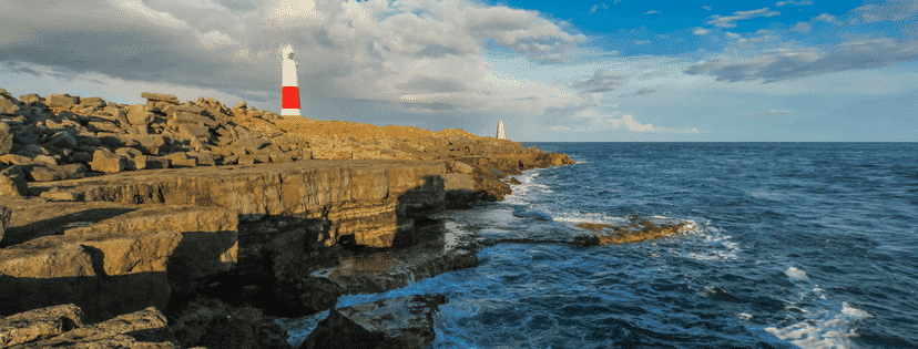 lonesome lighthouse standing on the shore of england