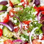 This easy Greek salad is one of my favorite authentic Greek recipes! It comes out fresh and delicious every time. #gayglobetrotter #greeksalad #salad #greekrecipe #tomato #cucumber #greek