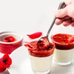 Strawberry panna cotta being scooped.