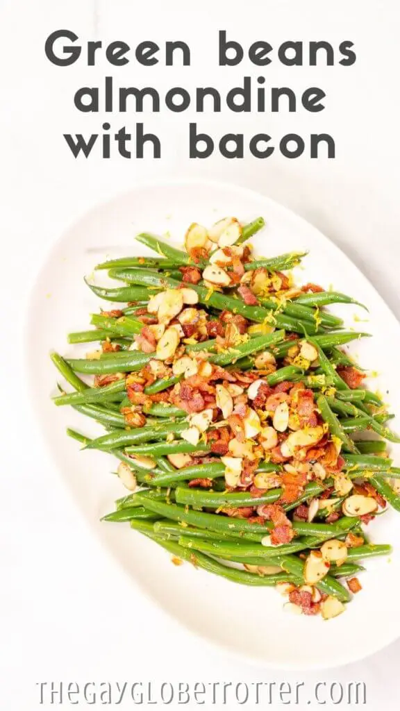 A platter of green beans almondine with text overlay that reads "green beans almondine with bacon".