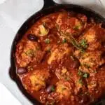 Chicken cacciatore being simmered with thyme.