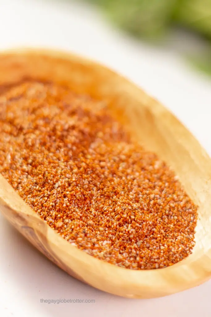 Homemade fajita seasoning in a wooden dish.