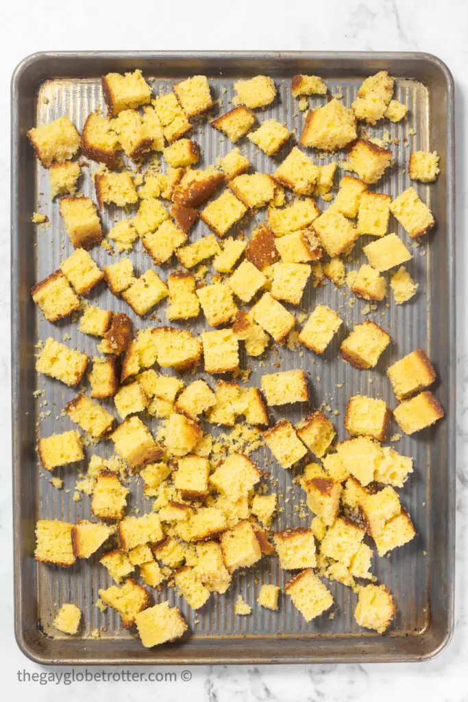 A tray of cornbread cubes being dried.