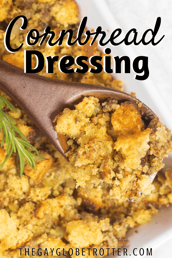 Cornbread stuffing being served with a wooden serving spoon.