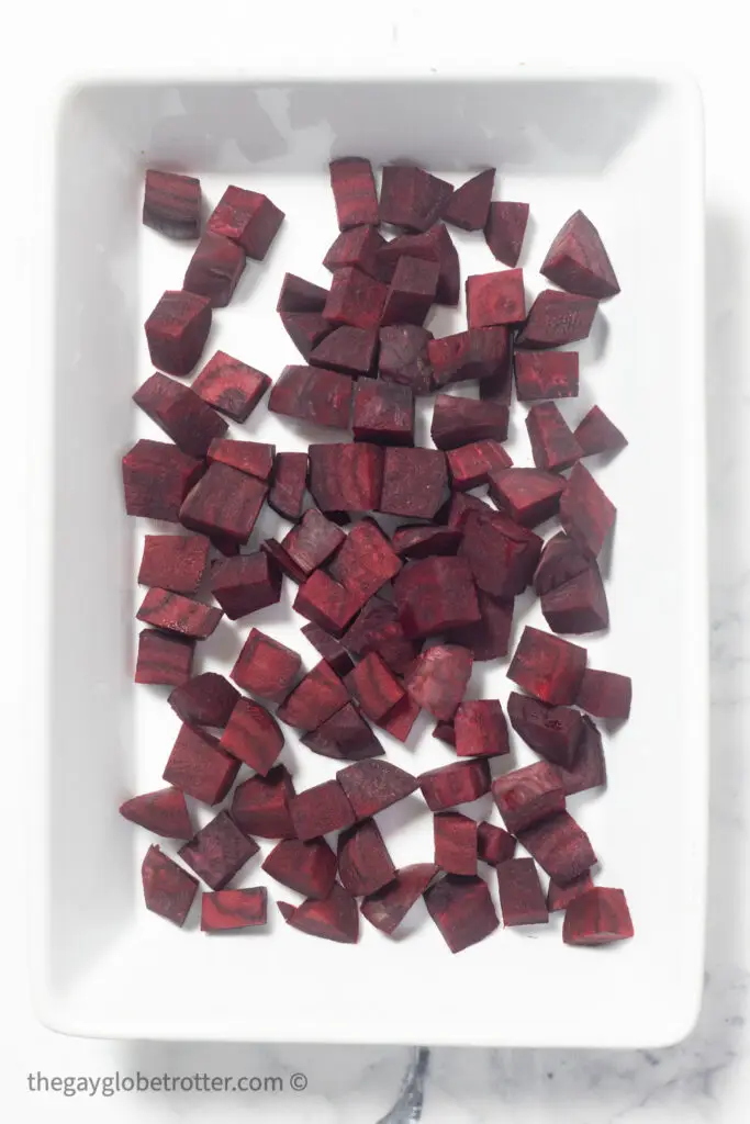 1" chunks of beets arranged in a baking dish. 