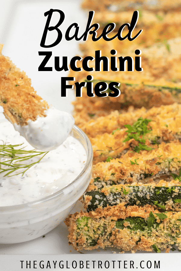 A zucchini stick dipped in dill dip.