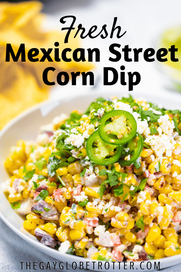 Mexican street corn dip in a serving dish with text overlay.