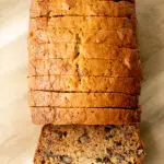 Banana bread sliced on a serving plate.