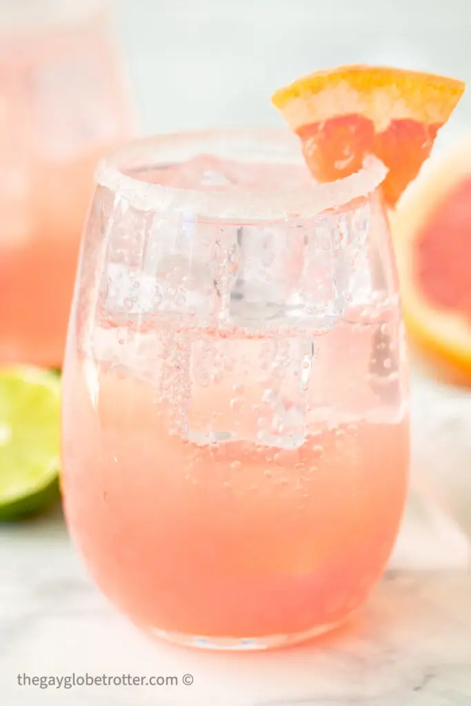 A paloma garnished with a grapefruit wedge.