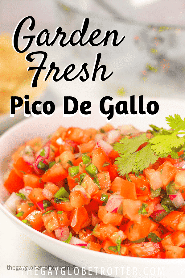 A bowl of pico de gallo topped with fresh cilantro and jalapenos.